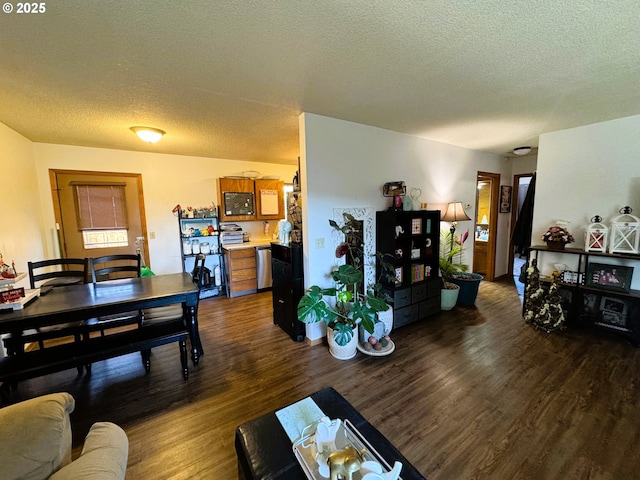 living room with dark wood finished floors and a textured ceiling