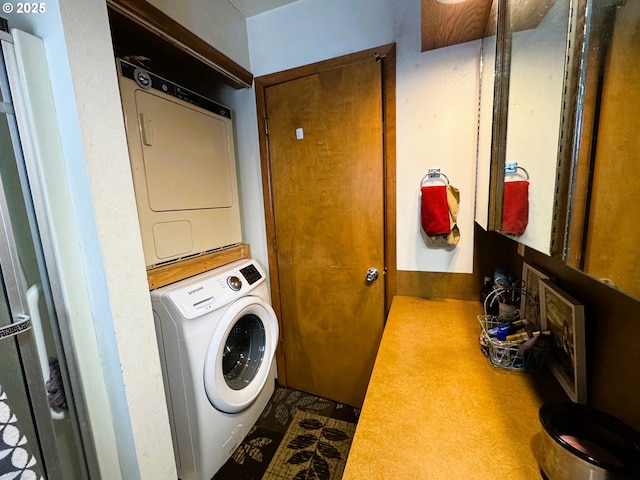 laundry room with laundry area and stacked washing maching and dryer