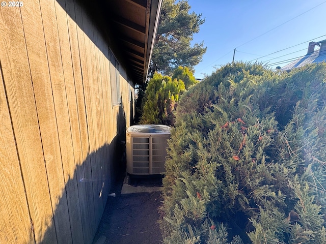 view of side of home featuring central air condition unit