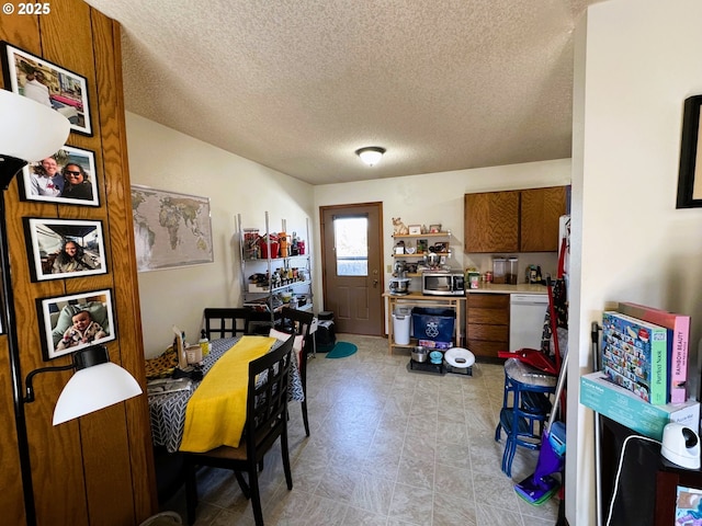 dining room with a textured ceiling