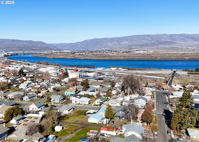 bird's eye view with a residential view and a water and mountain view