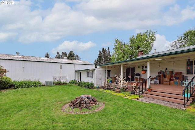 28805 Royal Ave, Eugene, OR 97402 - rear view of house with a chimney, a yard, and central air condition unit