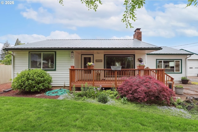 28805 Royal Ave, Eugene, OR 97402 - back of property featuring a lawn, a chimney, and metal roof