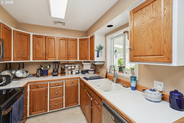 28805 Royal Ave, Eugene, OR 97402 - kitchen with a sink, stainless steel appliances, brown cabinets, and light countertops
