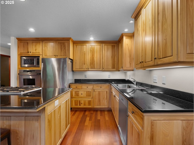 24982 E Tillicum St, Welches, OR 97067 - kitchen with appliances with stainless steel finishes, a sink, dark wood-type flooring, and recessed lighting