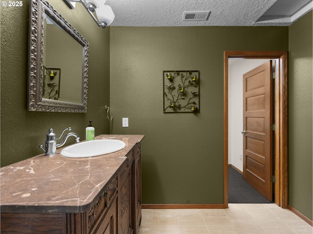 24982 E Tillicum St, Welches, OR 97067 - bathroom with baseboards, vanity, and a textured ceiling