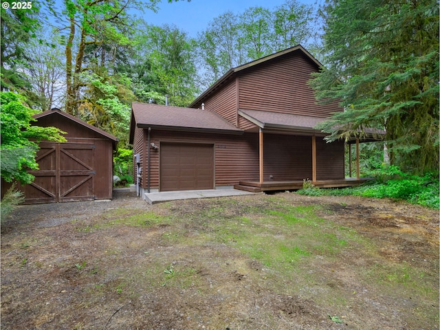 24982 E Tillicum St, Welches, OR 97067 - view of front of property featuring a garage and roof with shingles