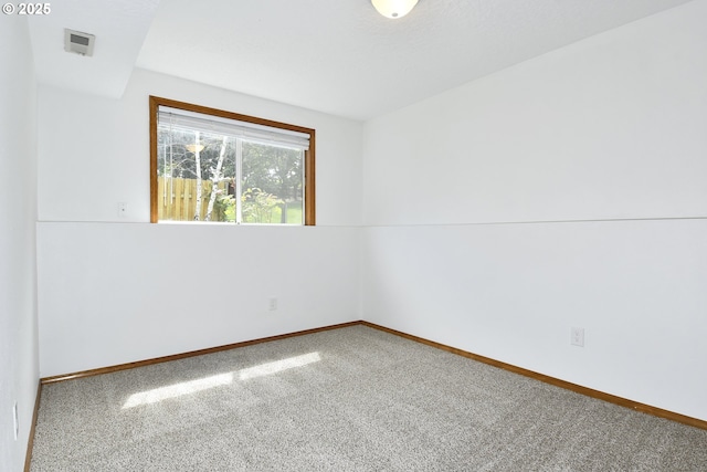 spare room with carpet flooring and baseboards