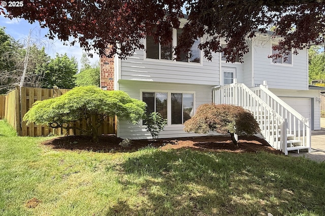 back of property with an attached garage