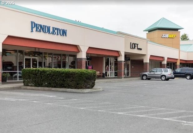 view of property with uncovered parking