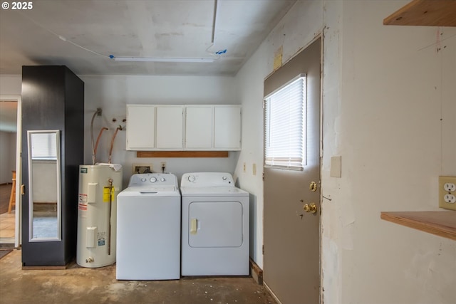 clothes washing area with water heater, separate washer and dryer, and cabinet space