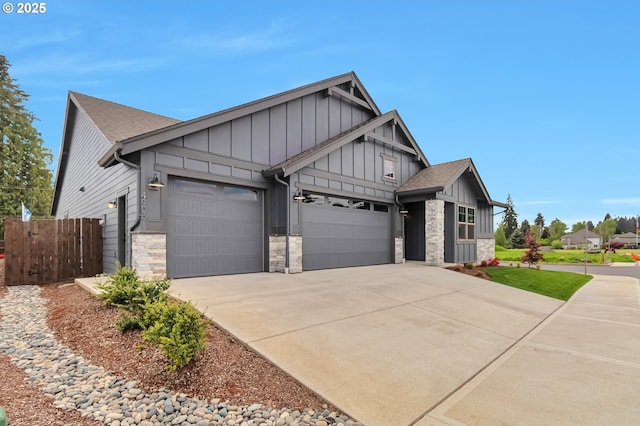 4905 NE 132nd Cir, Vancouver, WA 98686 - craftsman inspired home featuring board and batten siding, an attached garage, stone siding, and concrete driveway