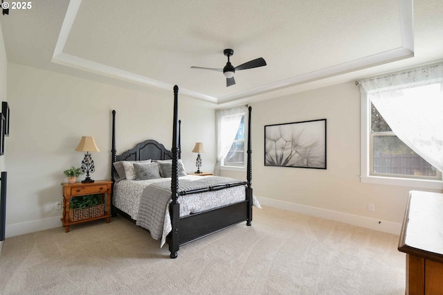 4905 NE 132nd Cir, Vancouver, WA 98686 - bedroom with a tray ceiling, light colored carpet, baseboards, and a ceiling fan