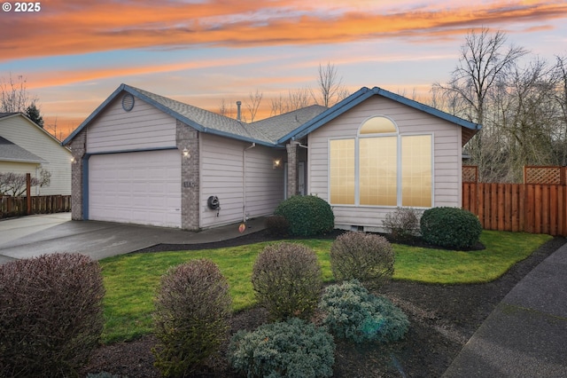 single story home with a garage and a lawn