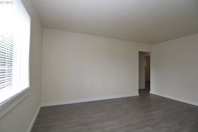 3159 Florida St, Longview, WA 98632 - empty room featuring dark wood-type flooring and baseboards