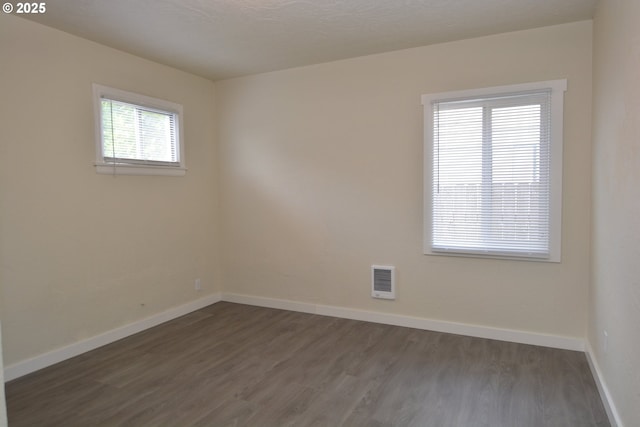 3159 Florida St, Longview, WA 98632 - empty room with dark wood finished floors and baseboards