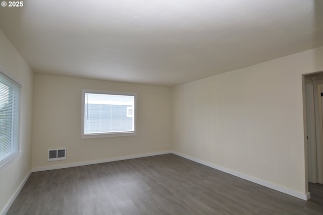 3159 Florida St, Longview, WA 98632 - empty room featuring dark wood-style floors and baseboards