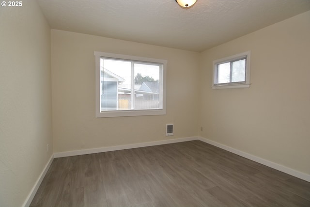 3159 Florida St, Longview, WA 98632 - empty room with dark wood-style floors and baseboards