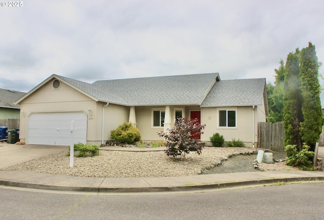 203 Robin Ct, Creswell, OR 97426 - view of front of house featuring an attached garage, concrete driveway, and roof with shingles