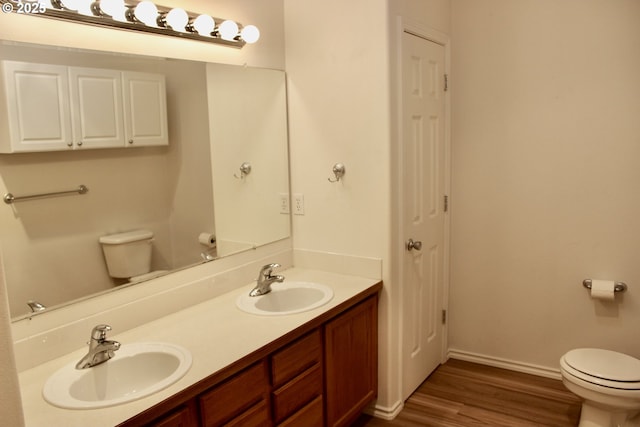 203 Robin Ct, Creswell, OR 97426 - bathroom with toilet, double vanity, wood finished floors, baseboards, and a closet