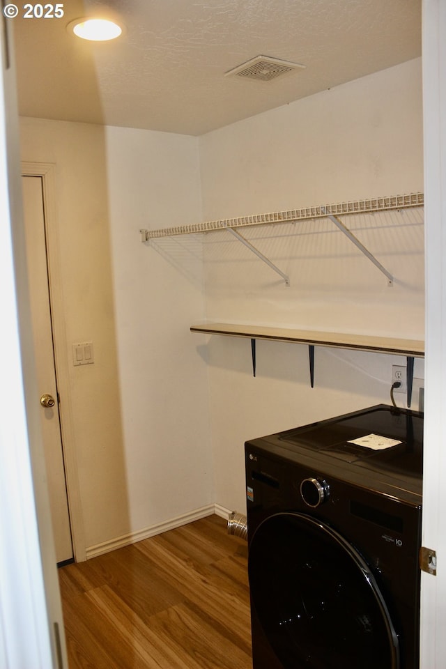 203 Robin Ct, Creswell, OR 97426 - washroom with washer / clothes dryer, wood finished floors, and baseboards