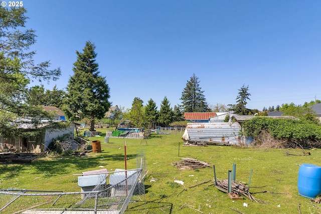 2165 Laura St, Springfield, OR 97477 - view of yard featuring fence, an outbuilding, and a storage shed