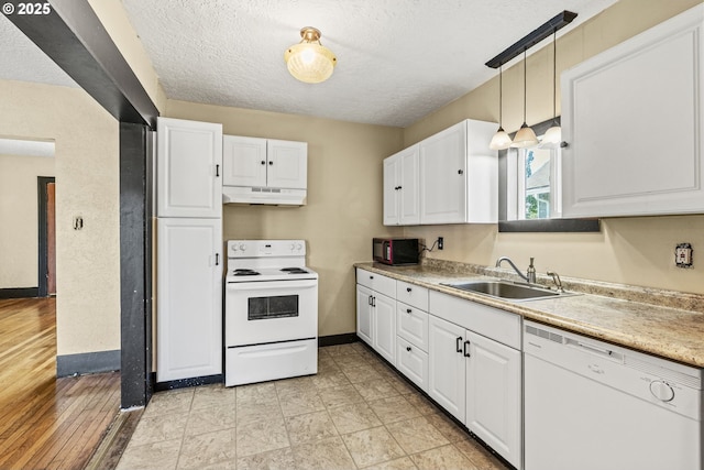 530 21st Ave, Longview, WA 98632 - kitchen featuring white appliances, a sink, under cabinet range hood, a textured ceiling, and white cabinetry