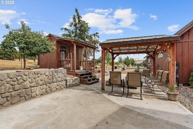 18122 Hulden Ln, Arlington, OR 97812 - view of patio featuring a gazebo, outdoor dining space, and an outbuilding