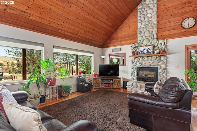 18122 Hulden Ln, Arlington, OR 97812 - living room with wood finished floors, a stone fireplace, wooden ceiling, and high vaulted ceiling