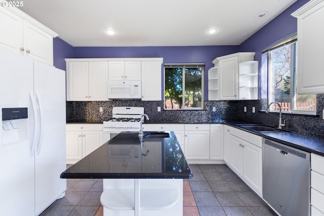 kitchen with white appliances, white cabinetry, a sink, and open shelves