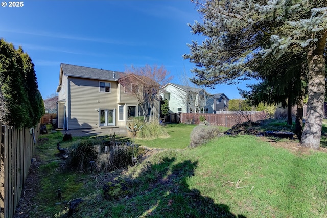 view of yard with a patio area and a fenced backyard