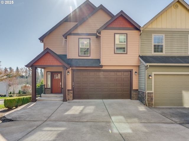 craftsman-style home with a garage, stone siding, a shingled roof, and concrete driveway