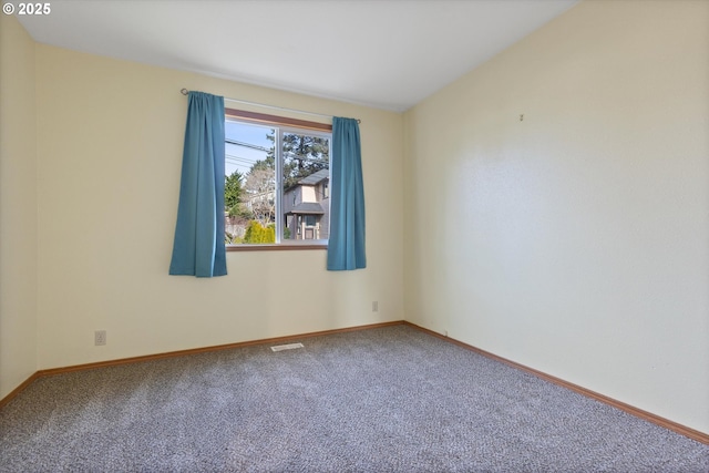 spare room featuring carpet flooring