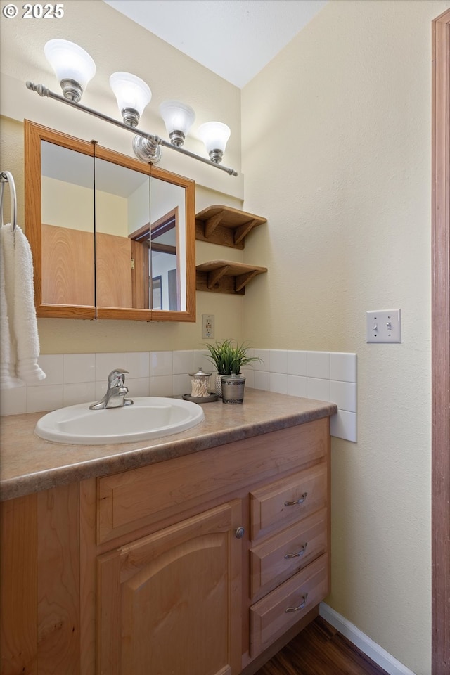 bathroom with hardwood / wood-style flooring and vanity