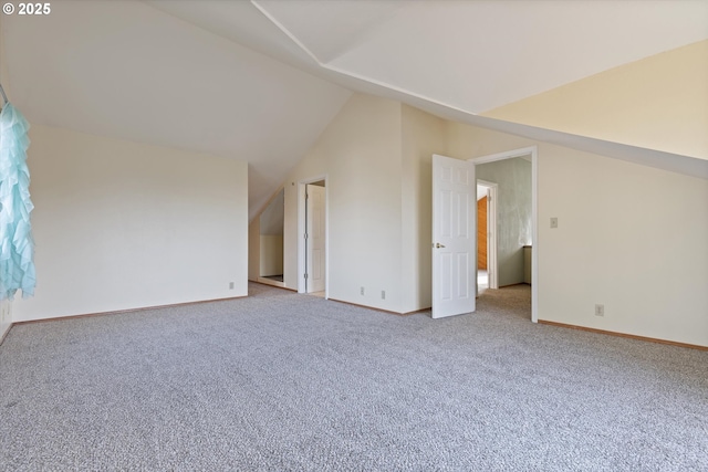 additional living space with lofted ceiling and light colored carpet