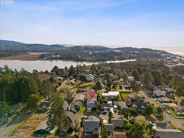 bird's eye view with a water and mountain view