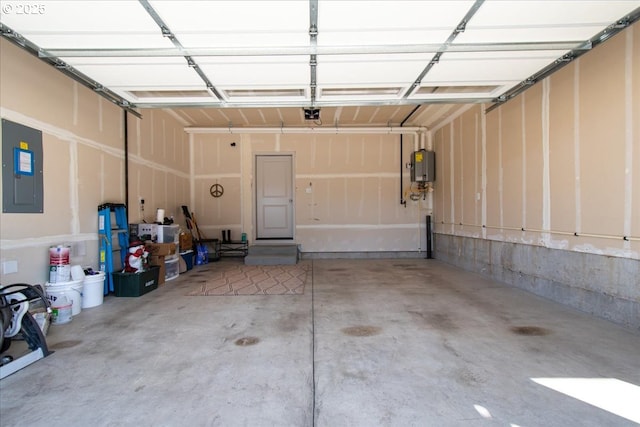 garage with a garage door opener and electric panel