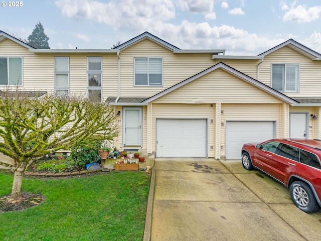 view of front of property featuring a front yard and a garage