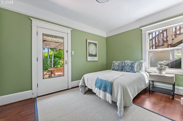 2804 NE 61st Ave, Portland, OR 97213 - bedroom with multiple windows, wood finished floors, and baseboards