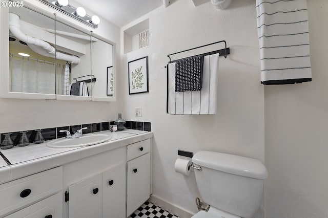 2804 NE 61st Ave, Portland, OR 97213 - bathroom with vanity, toilet, baseboards, and a shower with shower curtain