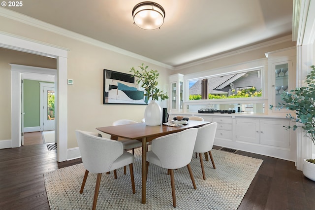 2804 NE 61st Ave, Portland, OR 97213 - dining space featuring plenty of natural light, dark wood-style flooring, ornamental molding, and baseboards
