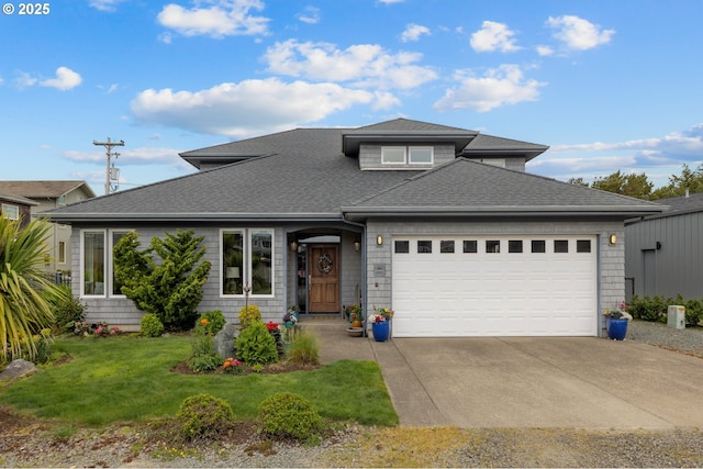 8866 Ocean Crest Ln, Manzanita, OR 97130 - view of front of house with roof with shingles, concrete driveway, a garage, and a front lawn