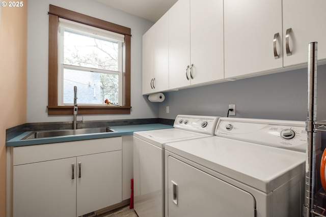 8866 Ocean Crest Ln, Manzanita, OR 97130 - washroom featuring cabinet space and independent washer and dryer