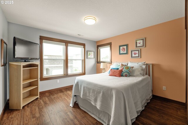 8866 Ocean Crest Ln, Manzanita, OR 97130 - bedroom with dark wood-type flooring and baseboards