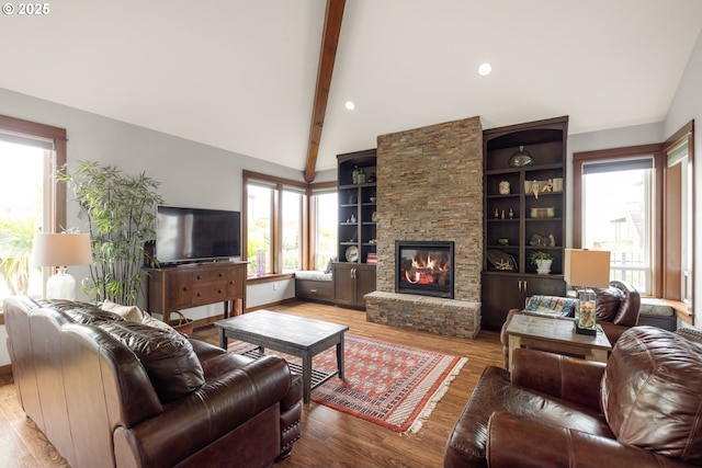 8866 Ocean Crest Ln, Manzanita, OR 97130 - living room featuring a stone fireplace and wood finished floors