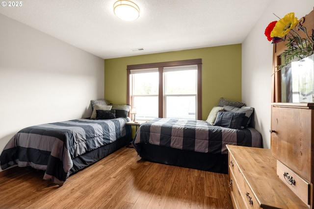 8866 Ocean Crest Ln, Manzanita, OR 97130 - bedroom featuring wood finished floors