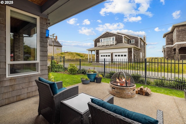 8866 Ocean Crest Ln, Manzanita, OR 97130 - fenced backyard with an outdoor fire pit, a garage, and a patio area