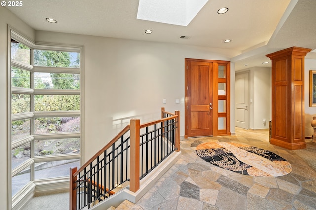 hallway with a skylight