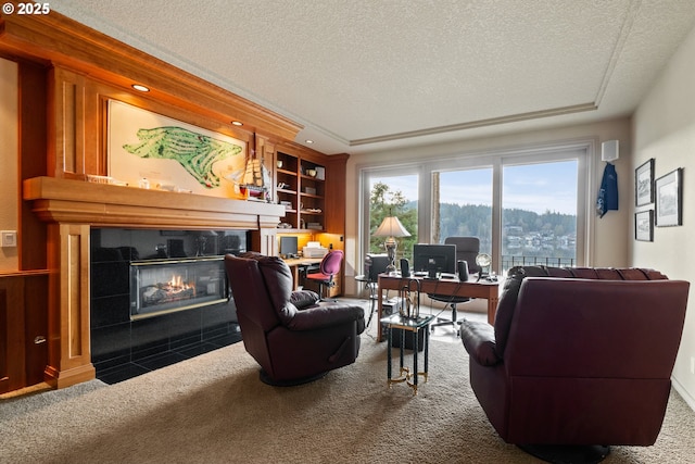 living room featuring carpet floors, a fireplace, and a textured ceiling