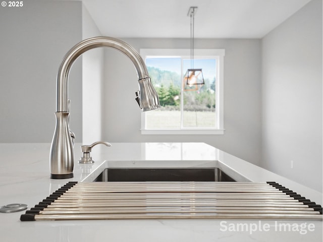 details with a sink and light countertops